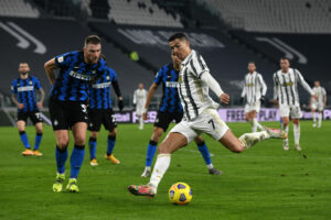 TURIN, ITALY - FEBRUARY 09: Cristiano Ronaldo of Juventus shoots during the Coppa Italia semi-final Juventus and FC Internazionale at Allianz Stadium on February 09, 2021 in Turin, Italy. Sporting stadiums around Italy remain under strict restrictions due to the Coronavirus Pandemic as Government social distancing laws prohibit fans inside venues resulting in games being played behind closed doors. (Photo by Chris Ricco/Getty Images)